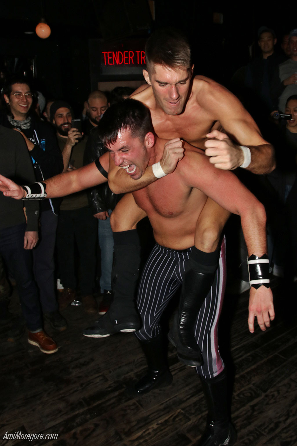 Zack Sabre Jr with a chin lock on Chuck Taylor in a Brooklyn bar - 2018
